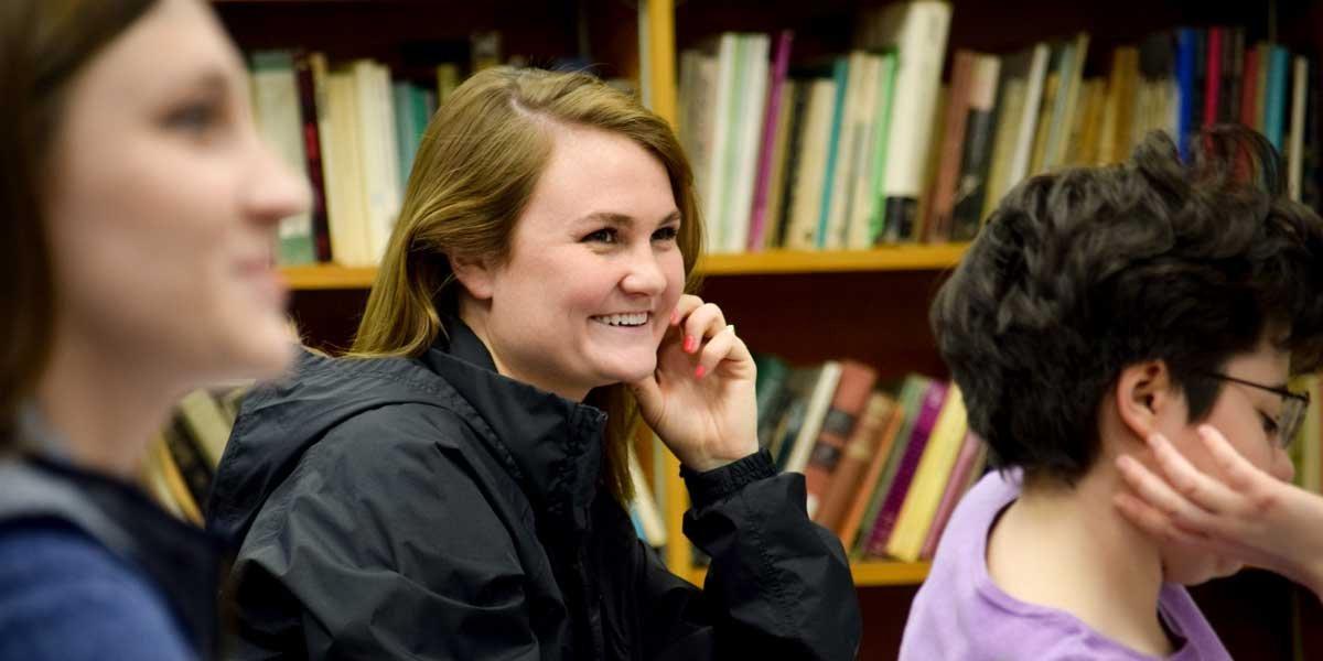 A student smiles in class