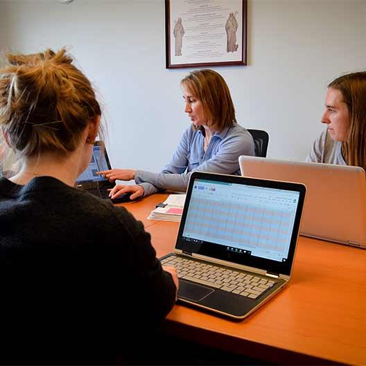 Professor talking with a few students