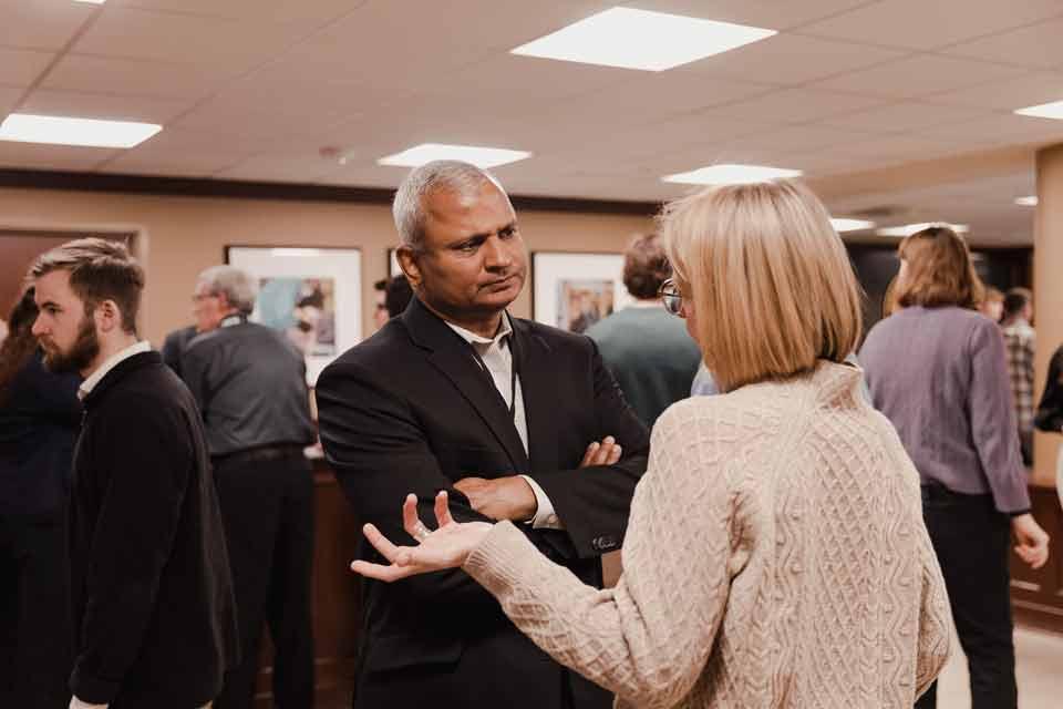 Attendees conversing at the Symposium on Transforming Culture